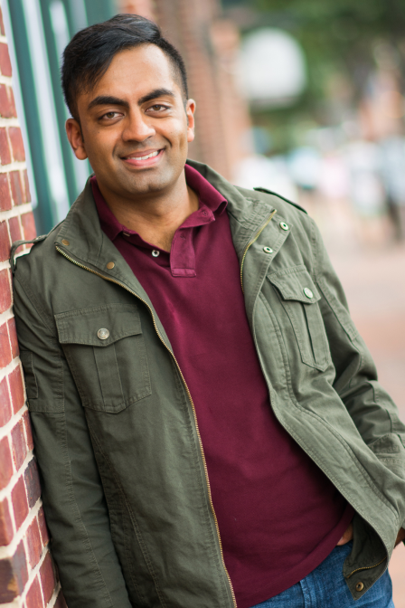 Mid eastern Man casual jacket three-quarter body dating profile photo leaning against wall