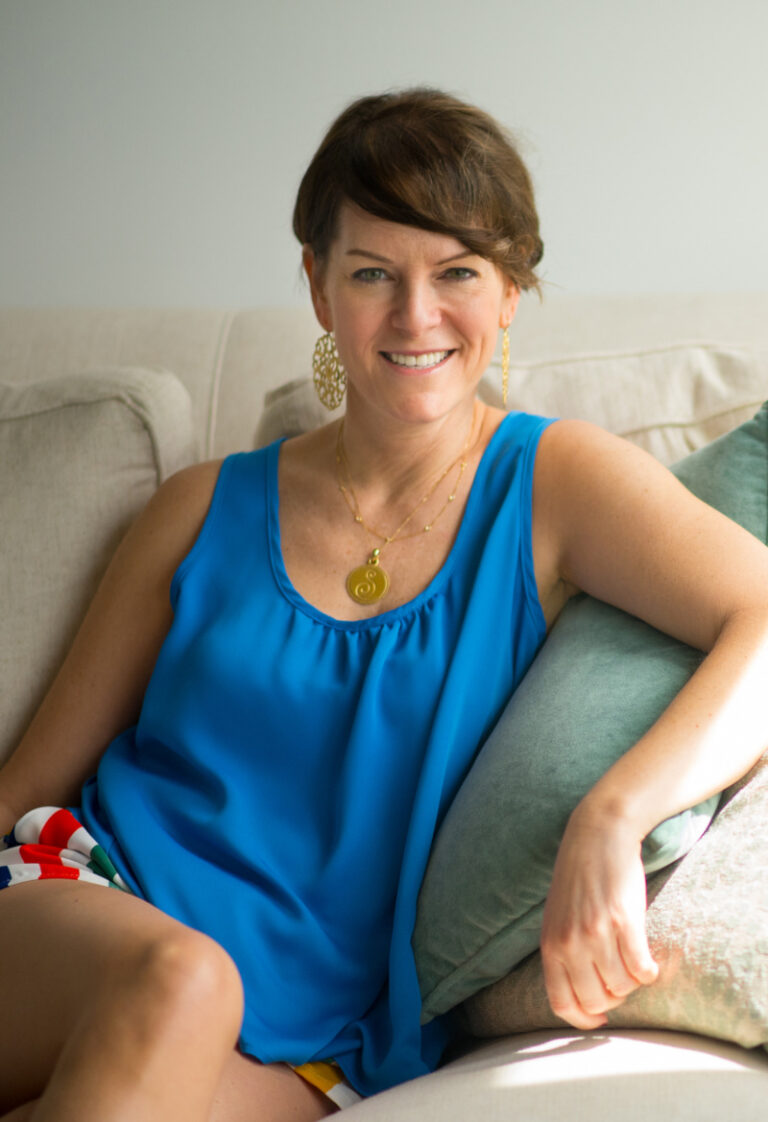 a woman sitting comfortably on a sofa